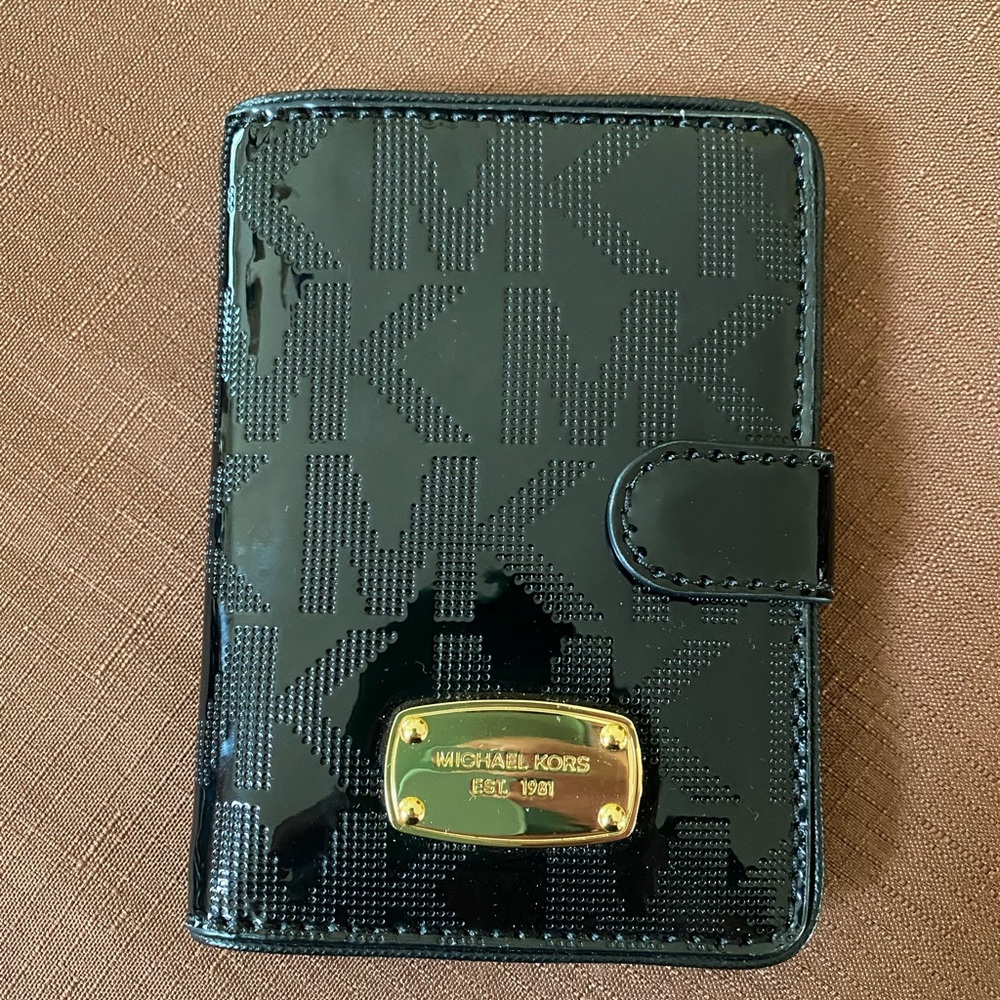 Michael Kors Black Perforated Signature
Patent Leather Passport Holder